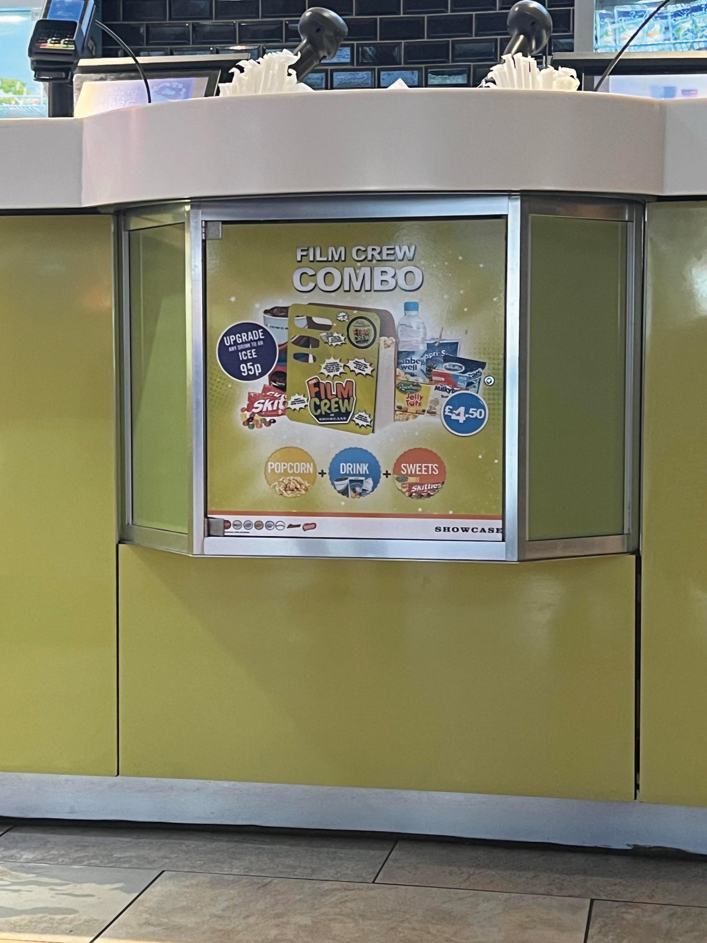 Printed point-of-sale graphic promoting a Film Crew Combo, installed on a cinema concession counter.