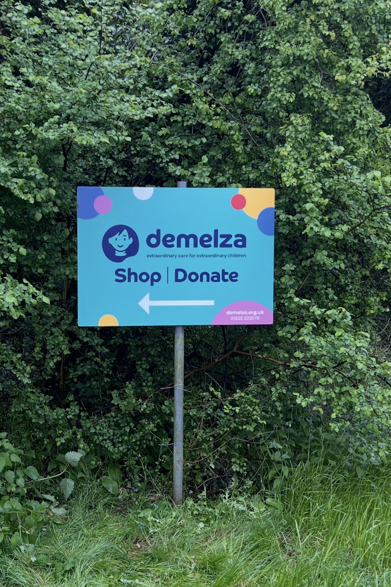 post and panel directional sign for charity Demelza