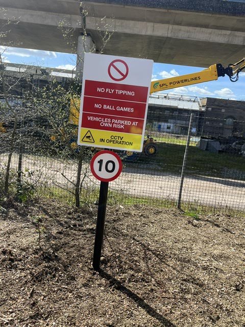 Post-mounted safety and speed limit signs displaying site rules, CCTV warning and a 10 mph limit.