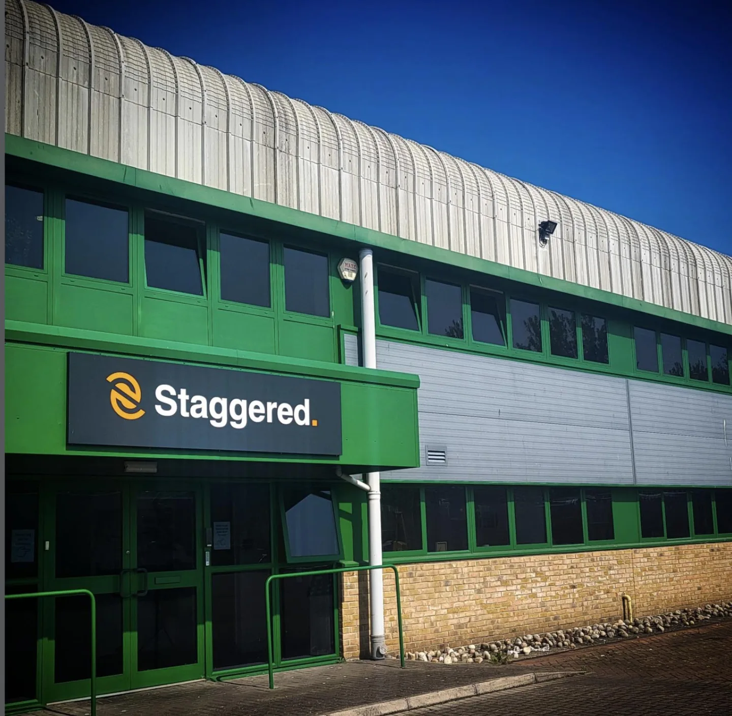 Metal folded tray sign with vinyl lettering on industrial unit