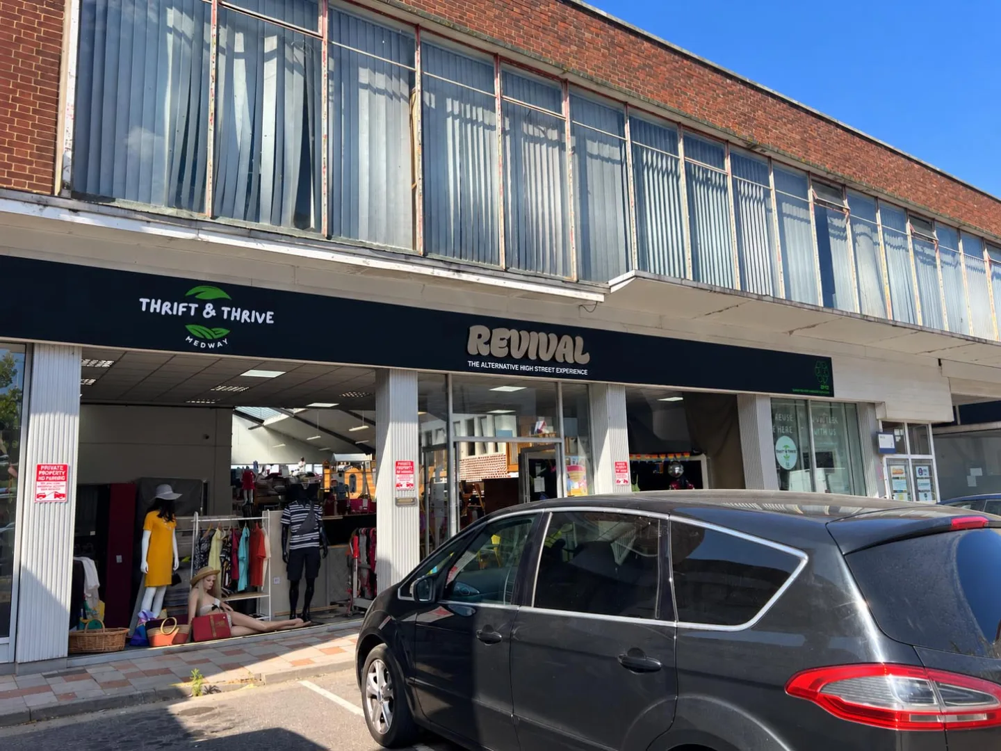 Completed Revival shopfront signage in Chatham, Kent, featuring a matt black ACM fascia, raised brushed bronze-effect lettering and Thrift & Thrive Medway branding.