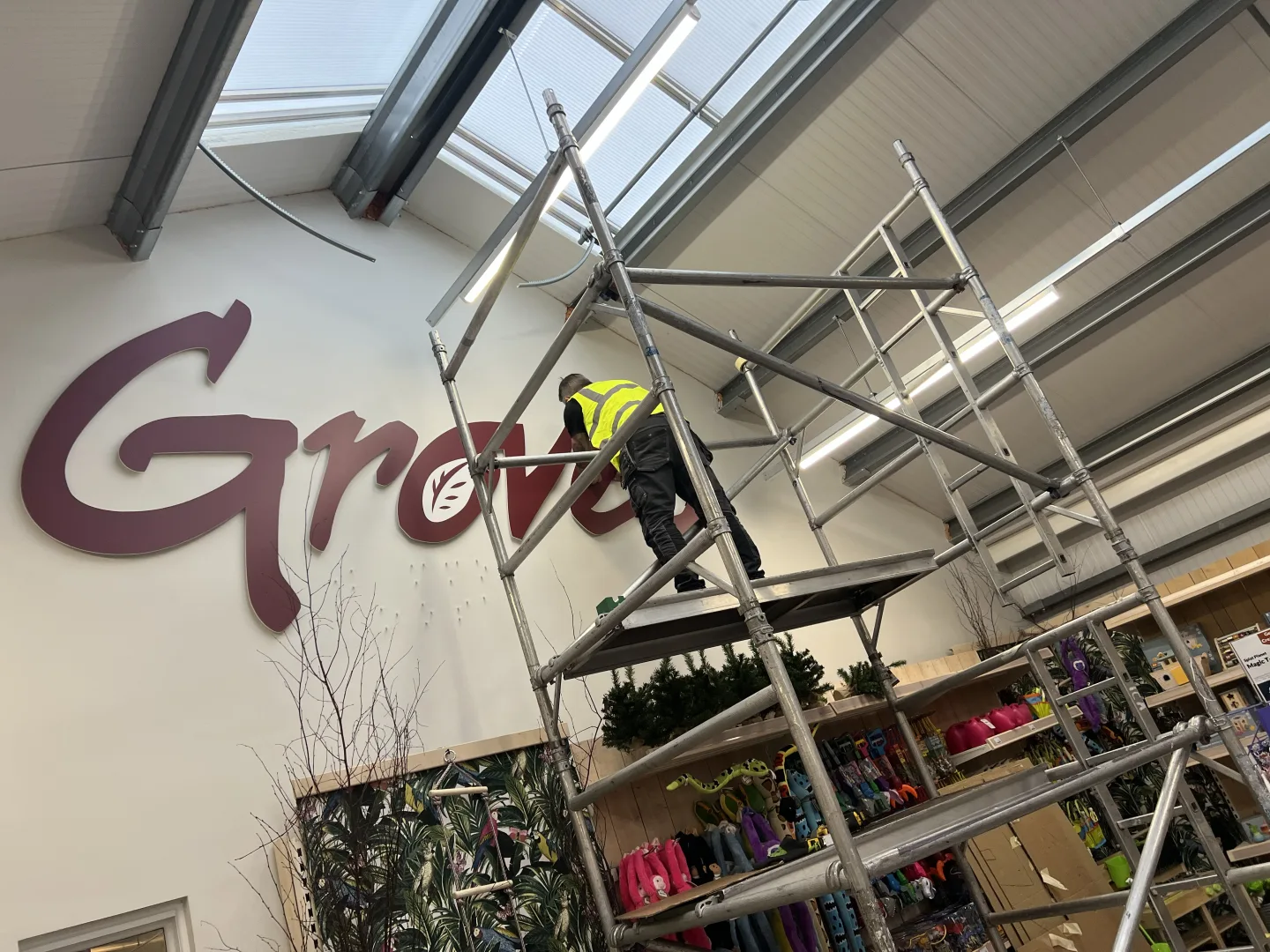 During installation of the signage using safety equipment and wearing high-vis shirts